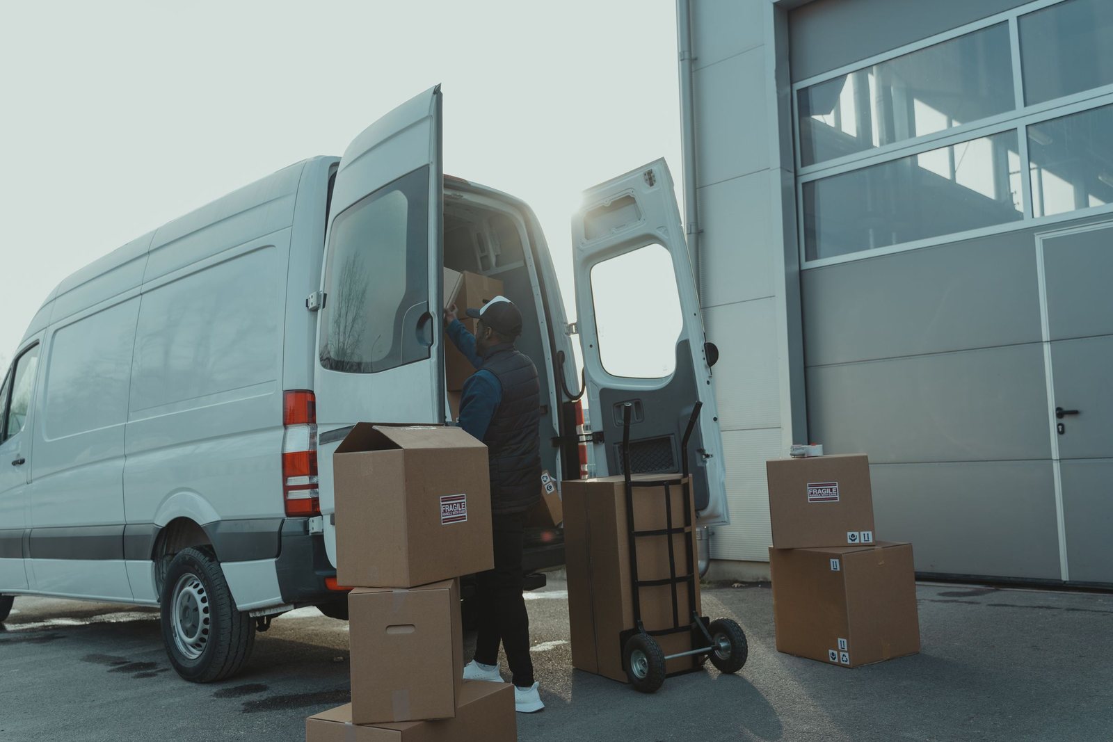 Furniture and boxes being trolleyed to a long wheelbase van