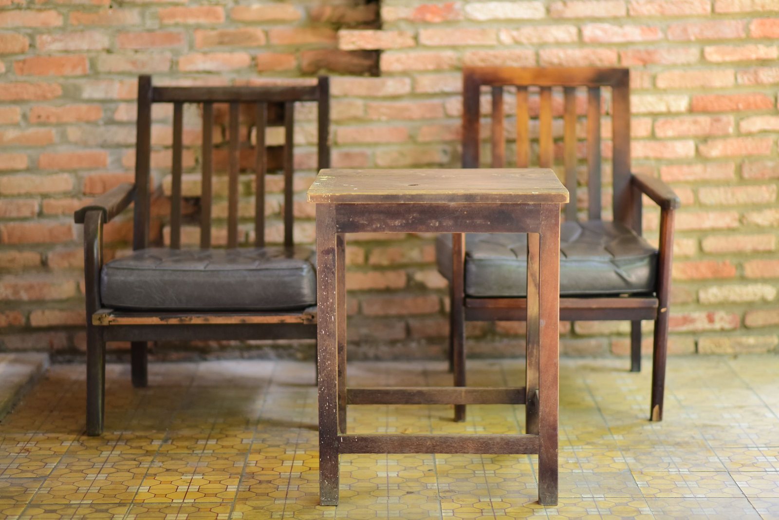 Second-hand wooden chairs and a table awaiting collection